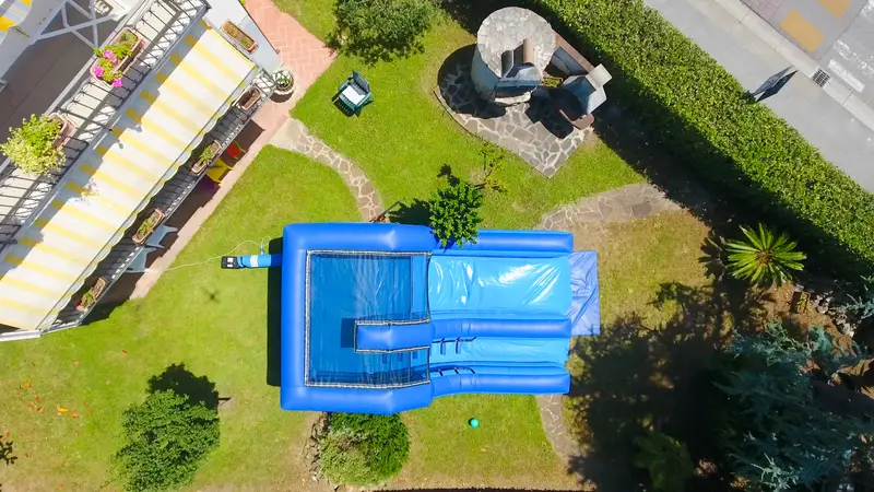 Aerial view of water slide bounce castle