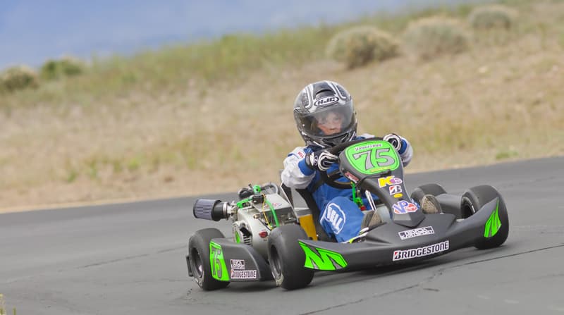 Kid driving a Go-Kart around the track