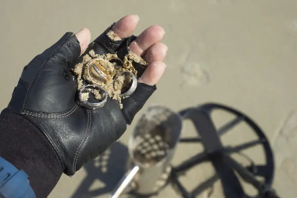 Metal rings in the hand of person on the beach
