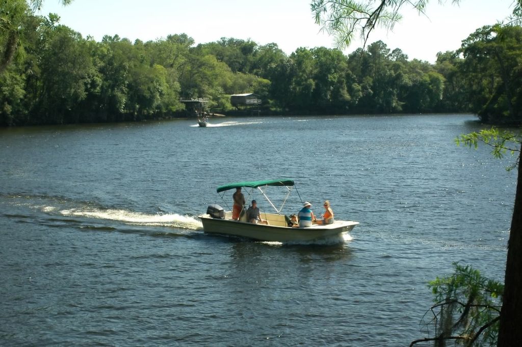 Family on a boat in the Suwannee River of Florida